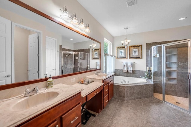 bathroom with tile patterned flooring, vanity, a chandelier, and plus walk in shower