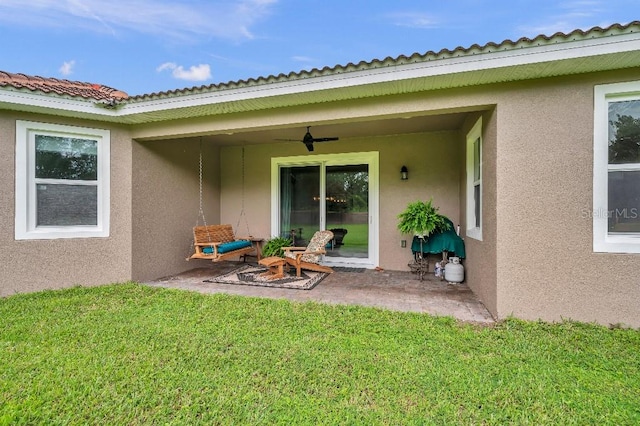 rear view of house with a yard and a patio area