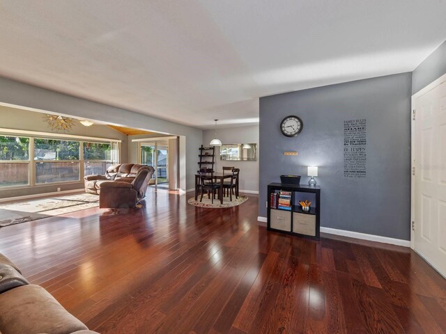 living room with dark hardwood / wood-style floors