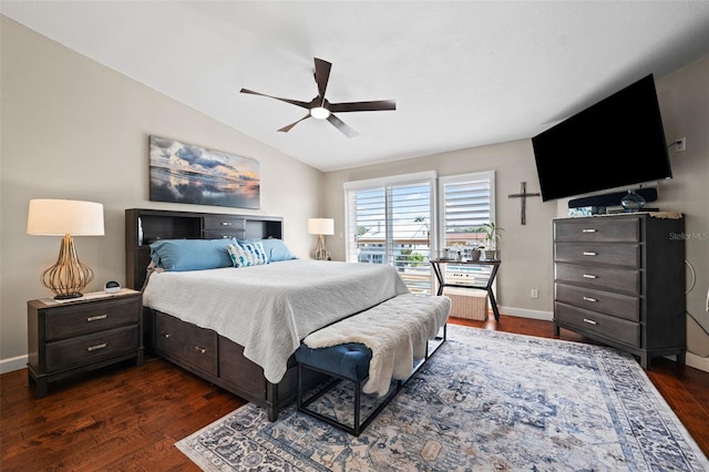 bedroom featuring vaulted ceiling, dark hardwood / wood-style floors, and ceiling fan