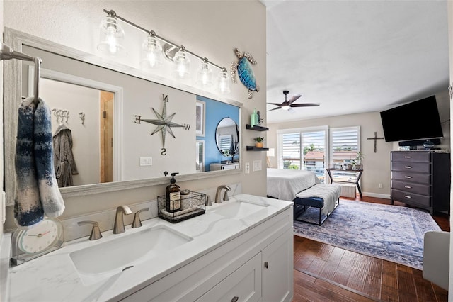 bathroom featuring vanity, ceiling fan, and hardwood / wood-style flooring