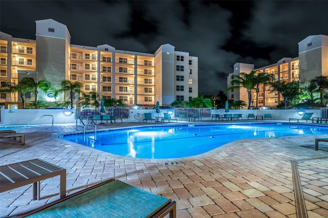 view of swimming pool featuring a patio area