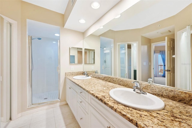 bathroom with vanity, tile patterned flooring, and an enclosed shower