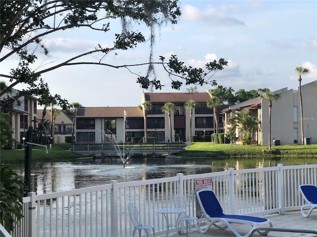 exterior space featuring a water view and a yard