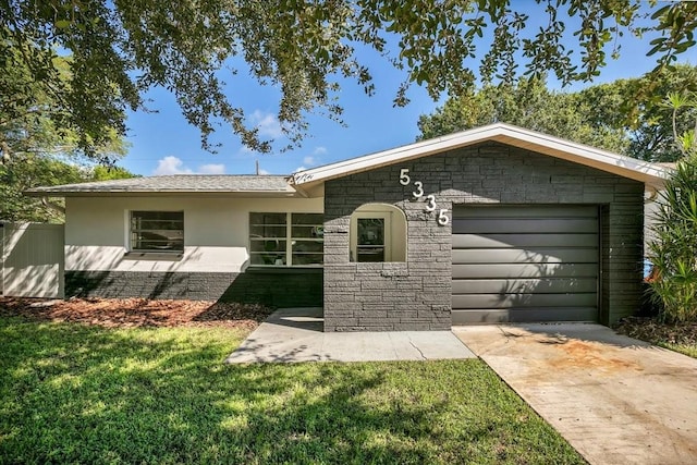 exterior space with a garage and a front yard