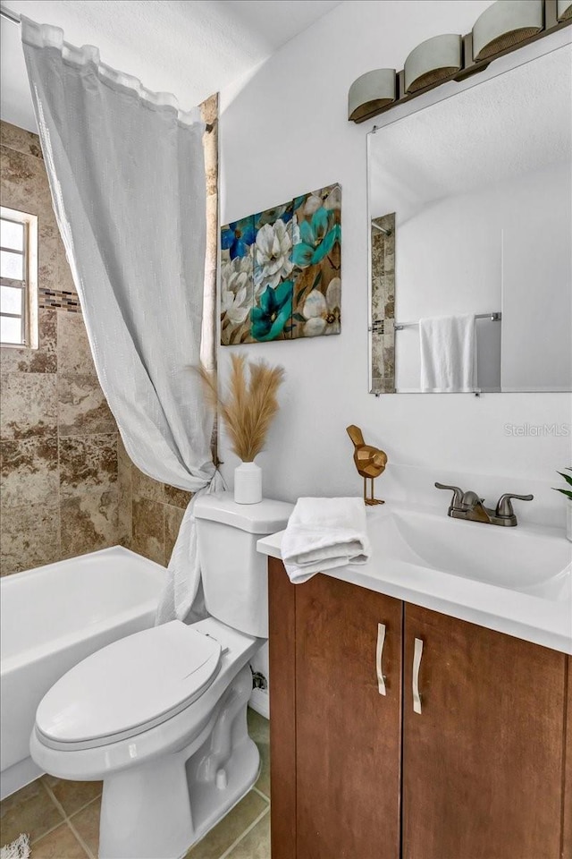 full bathroom with tile patterned flooring, shower / bath combo, vanity, and toilet