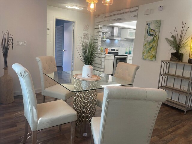 dining space with dark wood-type flooring