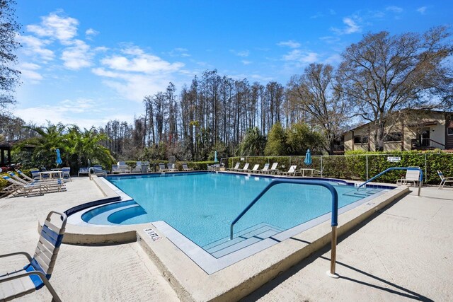 view of swimming pool featuring a patio area