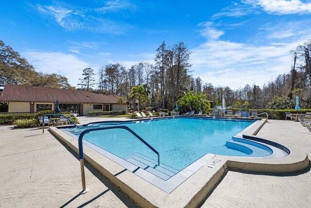 pool with a patio