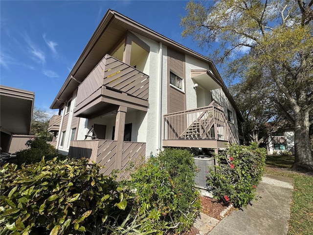 view of home's exterior featuring stucco siding and central air condition unit