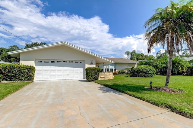 ranch-style house with a garage and a front yard