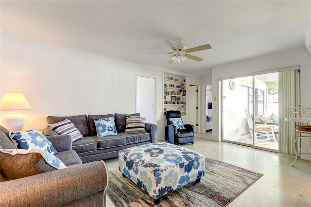 living room with ceiling fan and built in features