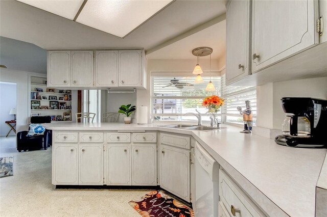 kitchen with white cabinets, white dishwasher, sink, kitchen peninsula, and decorative light fixtures