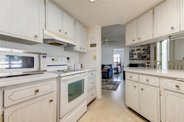 kitchen featuring backsplash, white appliances, ceiling fan, and white cabinets