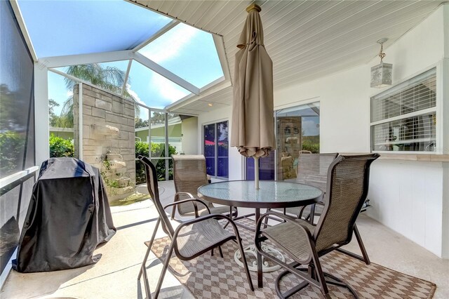 sunroom featuring lofted ceiling