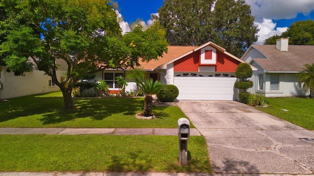 single story home featuring a garage and a front lawn