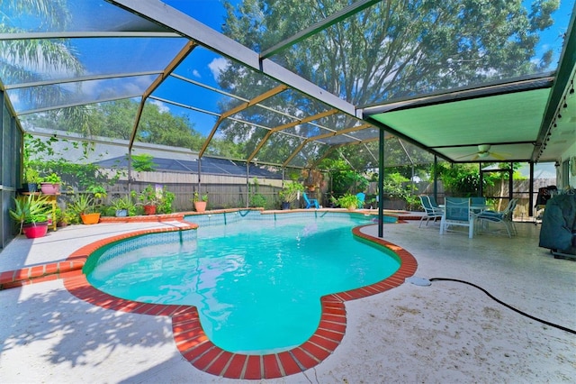 view of pool with a lanai and a patio area