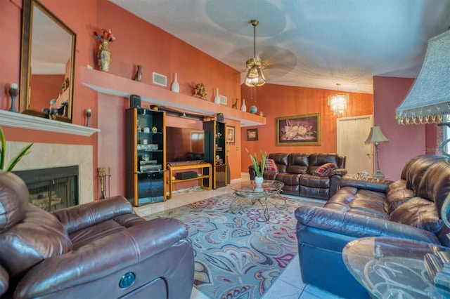 tiled living room featuring a textured ceiling, ceiling fan, and vaulted ceiling