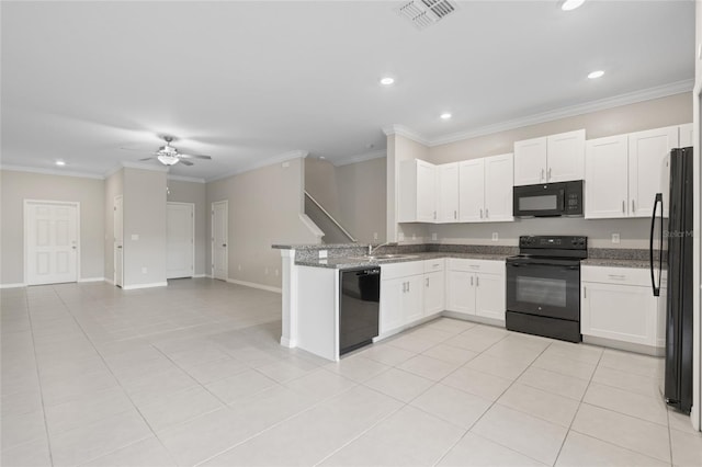 kitchen with black appliances, dark stone countertops, white cabinetry, and ceiling fan