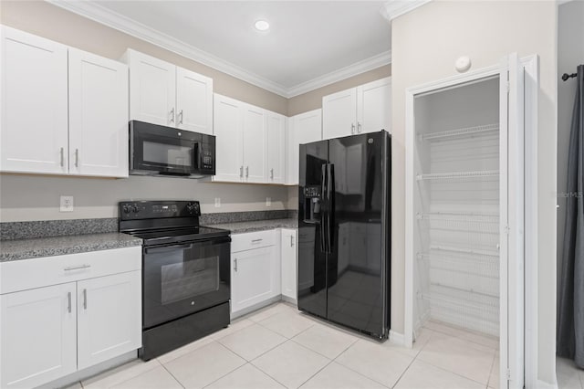 kitchen featuring ornamental molding, white cabinets, black appliances, and light tile patterned floors