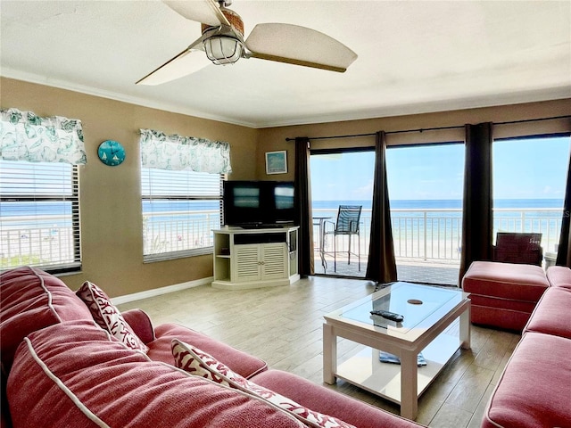 living room with hardwood / wood-style floors and ornamental molding