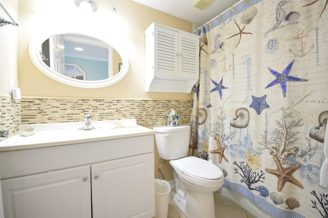 bathroom with decorative backsplash, tile patterned floors, walk in shower, vanity, and toilet