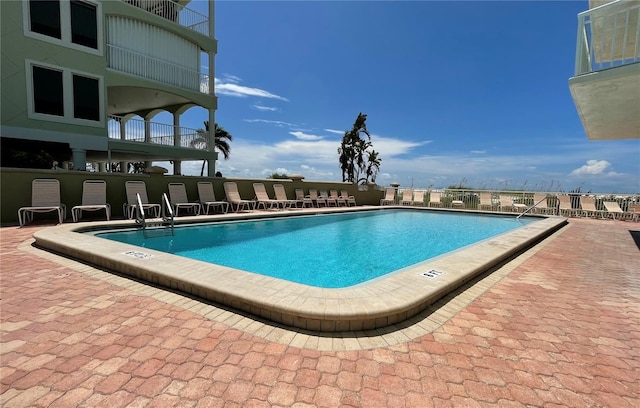 view of pool featuring a patio area