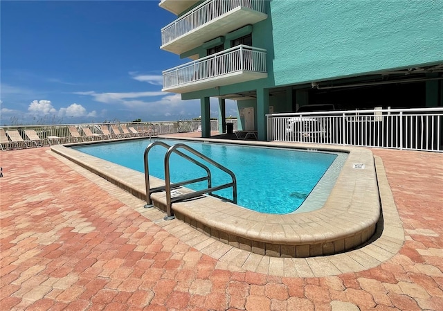 view of pool featuring a patio