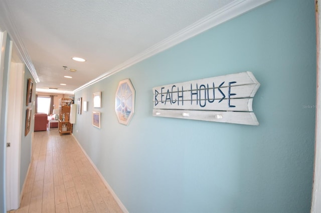 corridor featuring hardwood / wood-style floors and crown molding