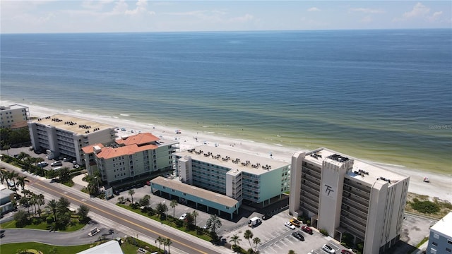 drone / aerial view with a beach view and a water view