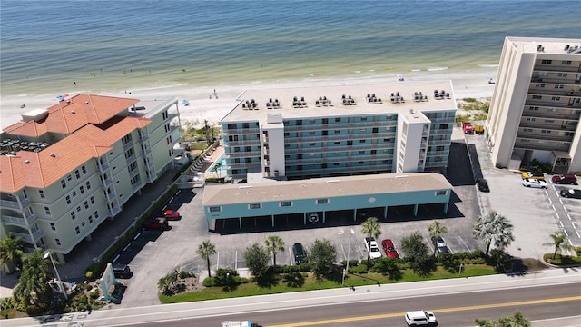 bird's eye view featuring a water view and a view of the beach