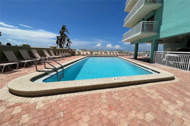 view of pool featuring a patio