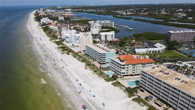 drone / aerial view with a beach view and a water view