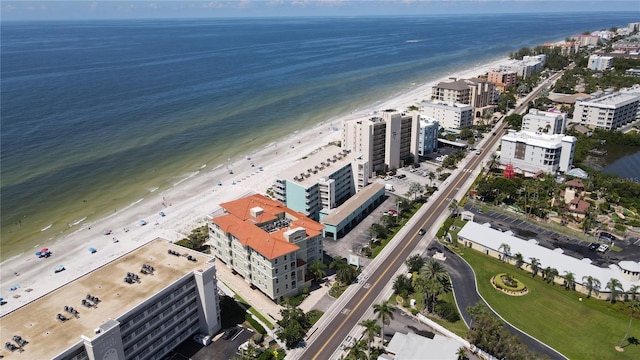 aerial view with a water view and a view of the beach