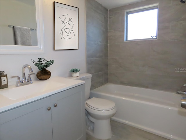 full bathroom with vanity, toilet, and tiled shower / bath