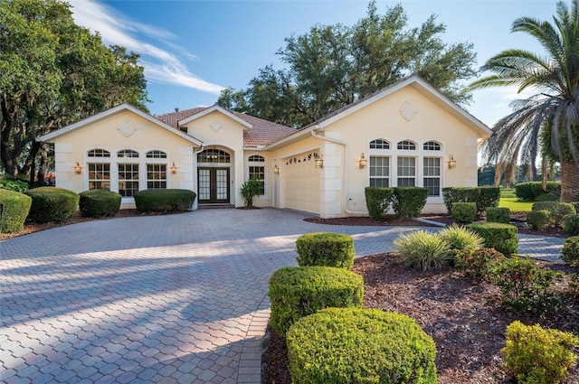 view of front of house featuring french doors and a garage