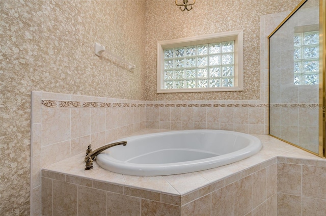 bathroom featuring tiled bath