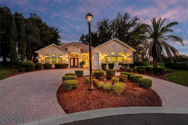 mediterranean / spanish-style home featuring french doors