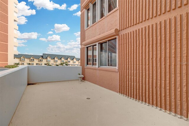 view of patio featuring a balcony