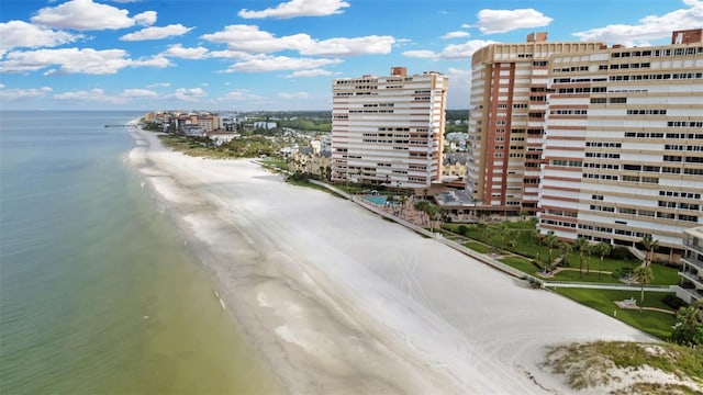 exterior space with a water view and a view of the beach