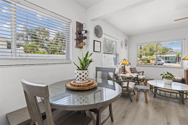 dining space with light wood-type flooring and plenty of natural light