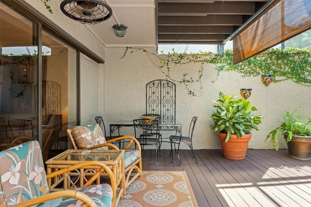 wooden balcony featuring a deck