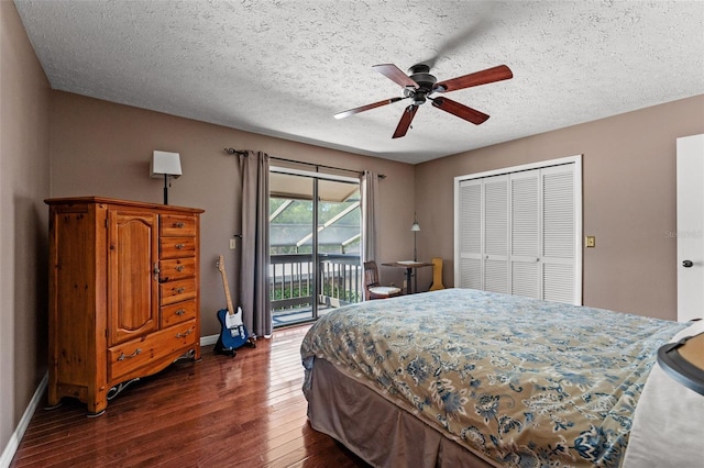 bedroom featuring dark wood-type flooring, ceiling fan, a textured ceiling, access to outside, and a closet