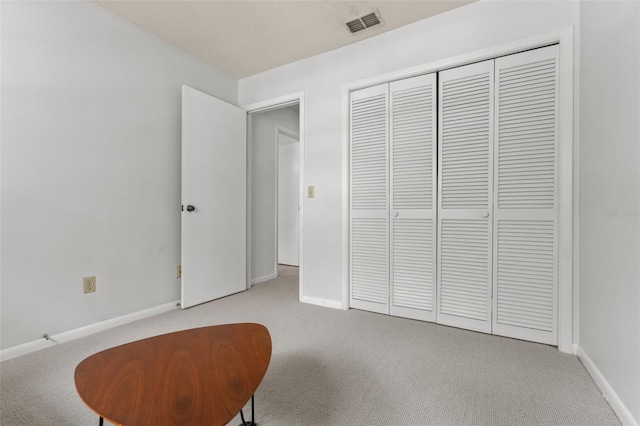 living area with light colored carpet