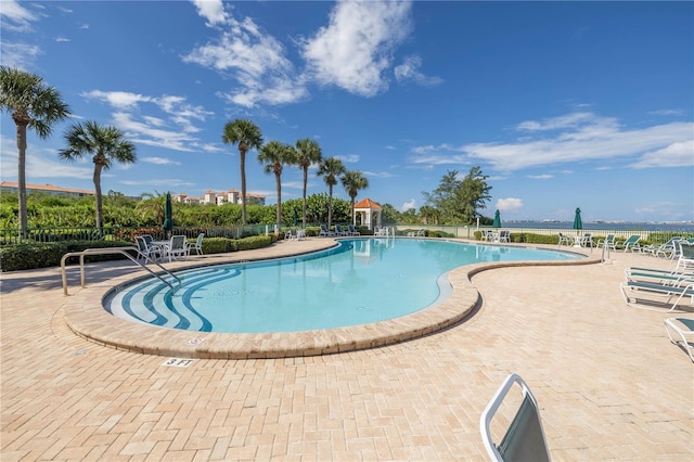 view of swimming pool with a patio area