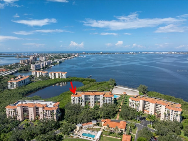 birds eye view of property with a water view