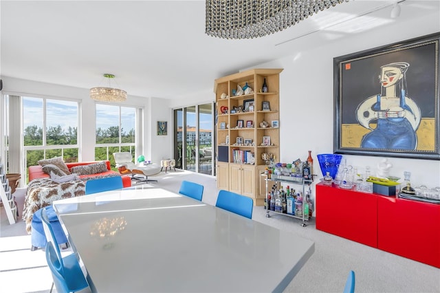 game room with an inviting chandelier and carpet flooring