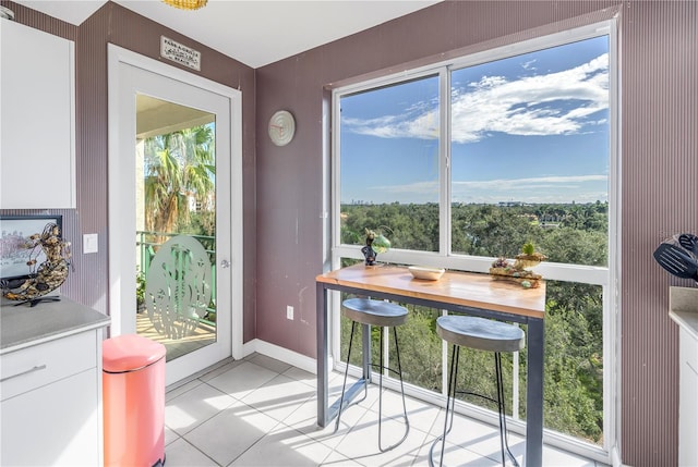 dining area with light tile patterned floors