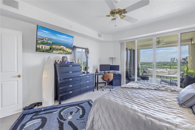 bedroom featuring ceiling fan, light colored carpet, and access to exterior