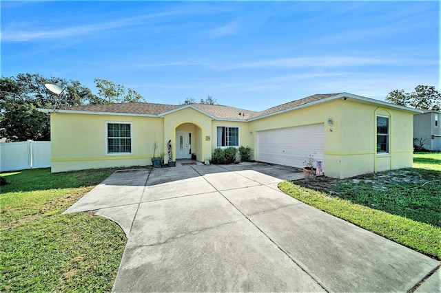 ranch-style home with a front lawn and a garage